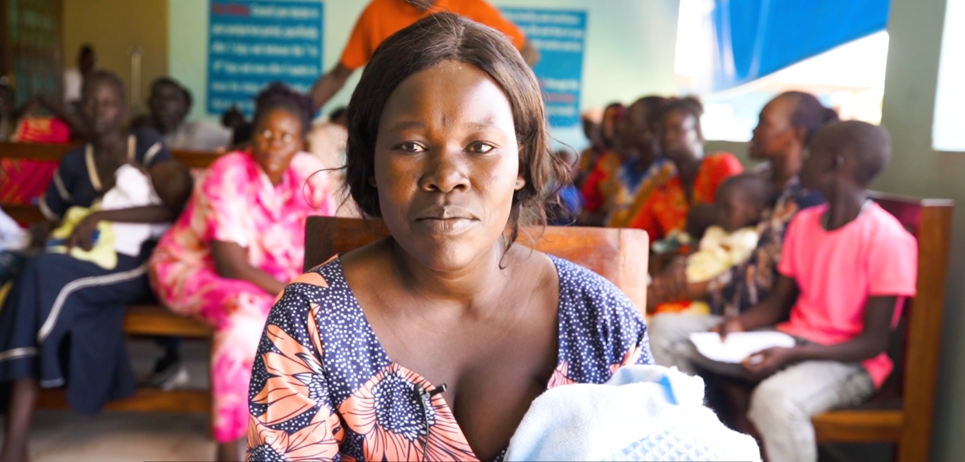 Adila Deng with her child at Gudele Block 4 Primary Health Care Centre, Juba